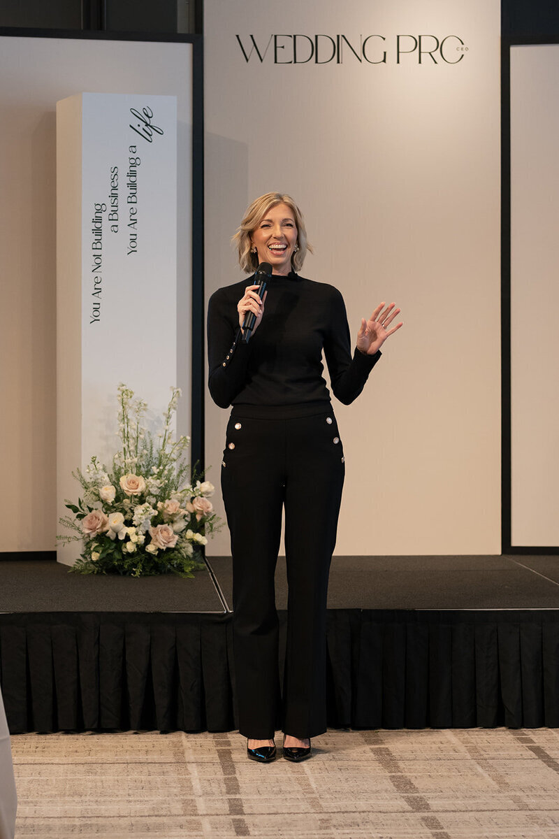 Brandee Gaar speaking to crowd at wedding industry conference