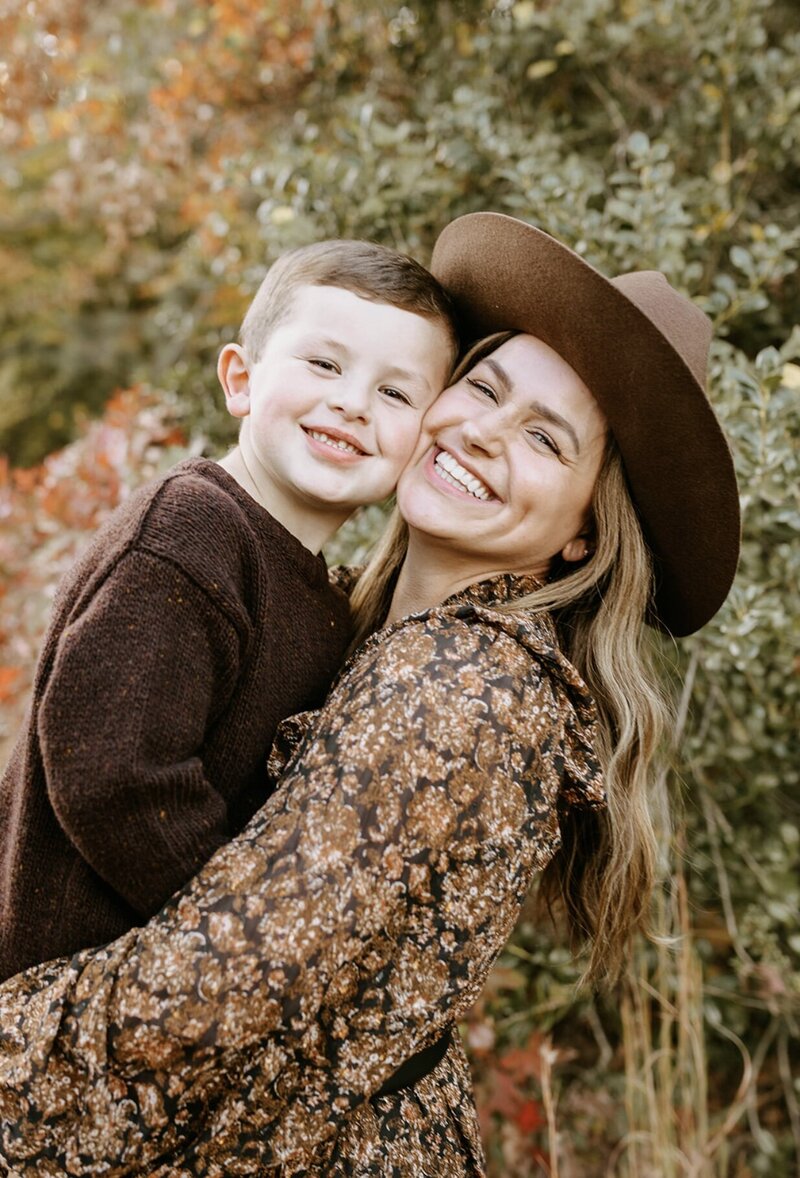 mom and son pose for a fall family photograph