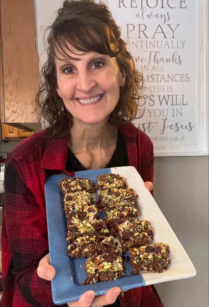 Penny holding a plate of homemade healthy treats