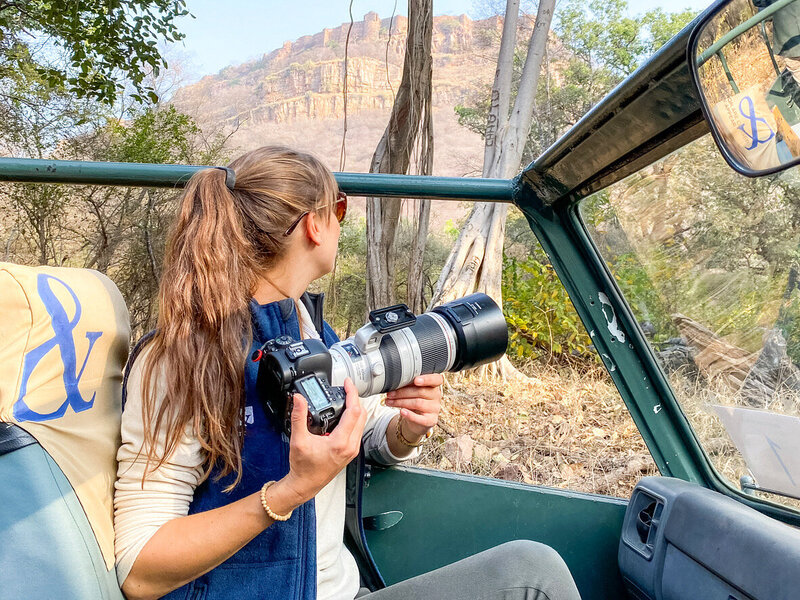 Woman photographing in African safari