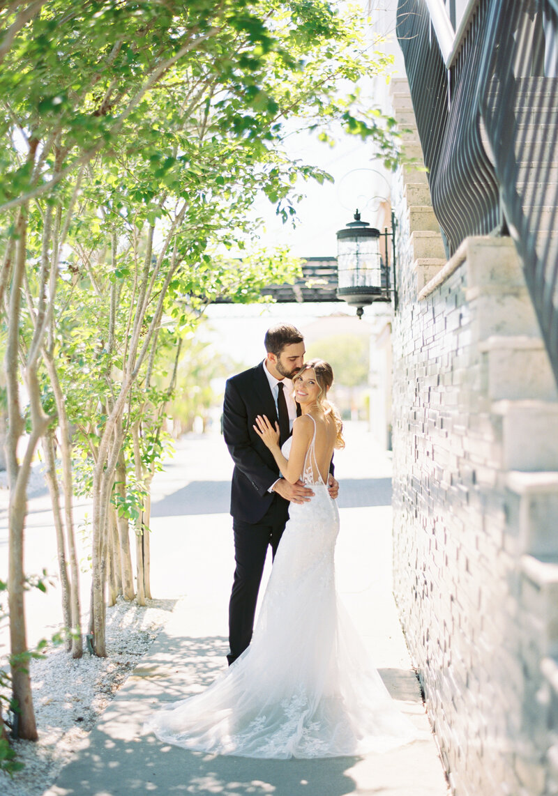 groom walking bride up stairs at sacred heart wedding