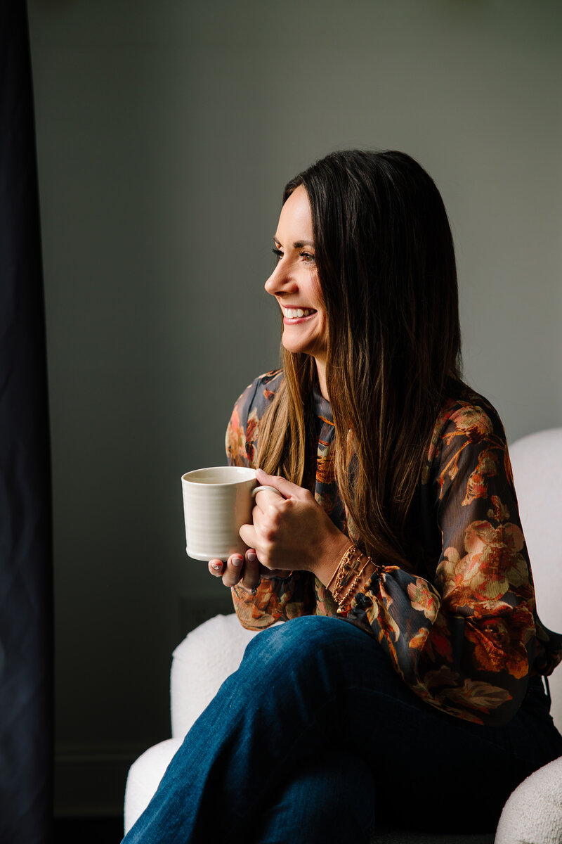 Christina holding a mug