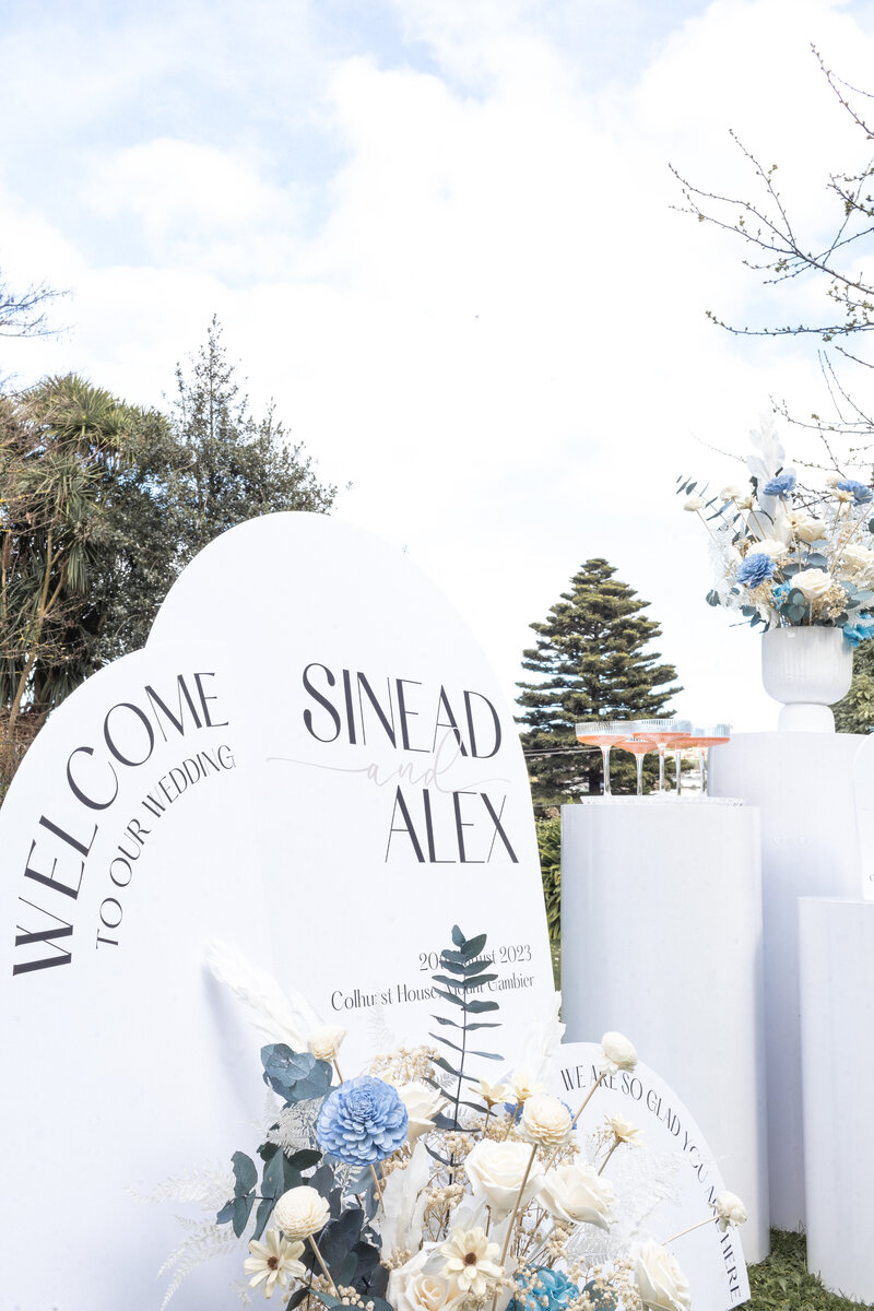 Personalised signage welcoming guests to a wedding ceremony.