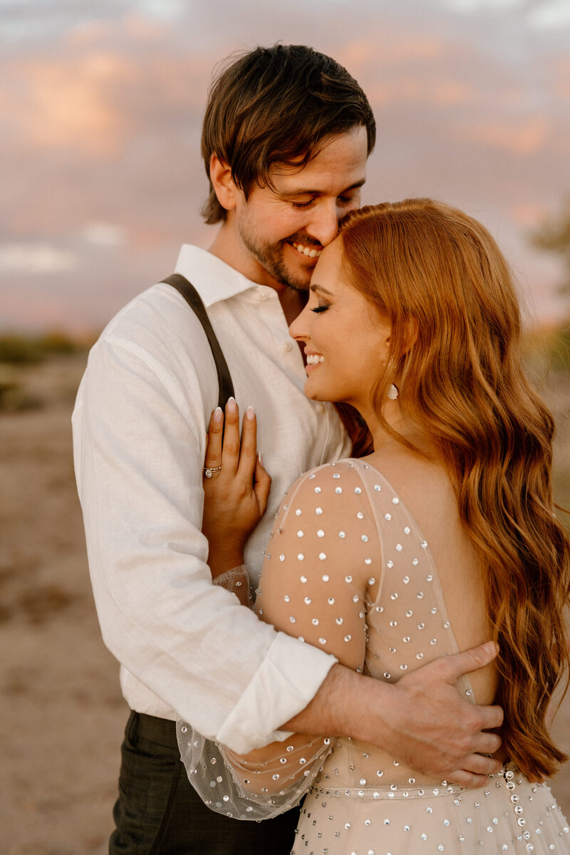 couple poses in arizona landscape