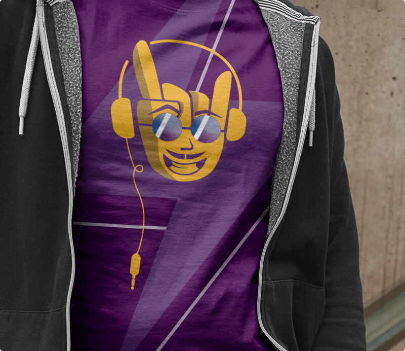 Man wearing a black jacket and a branded shirt of the Don Charlieee mascot.