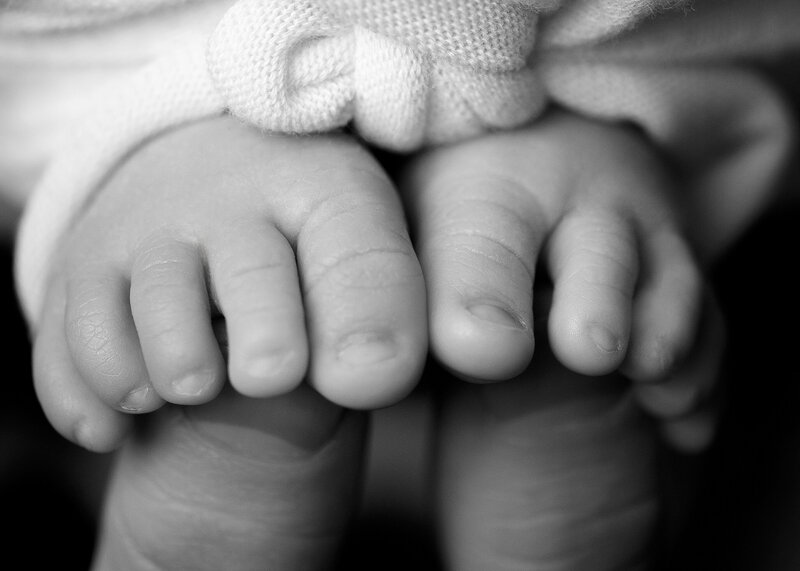 Syracuse baby details of toes in photo studio