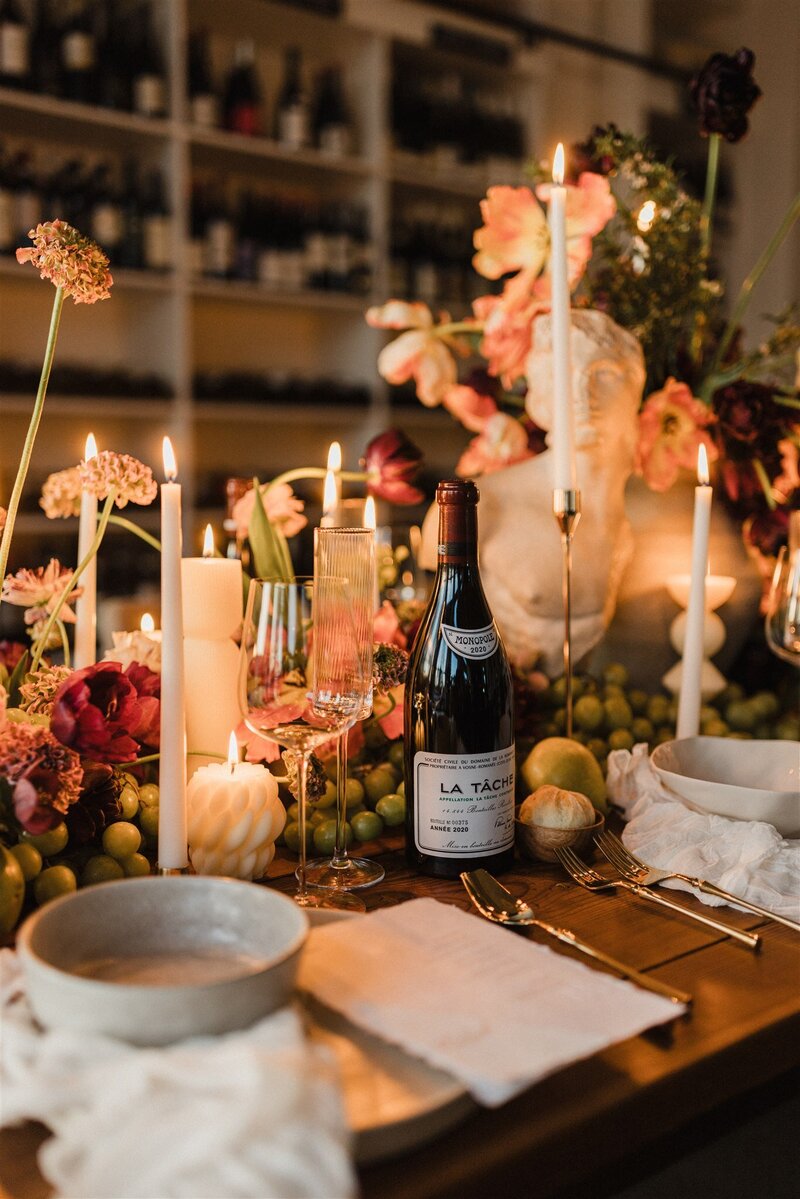 Intimate spring wedding ceremony with floral installation and candleligh