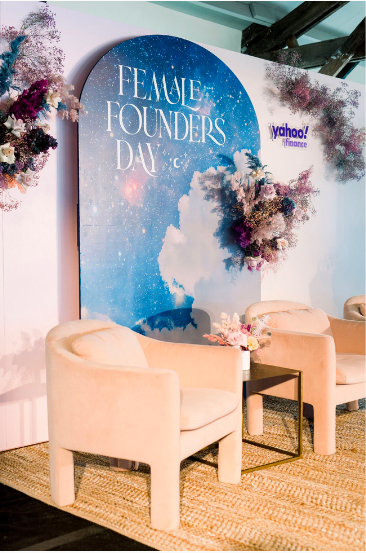 Elegant event stage styling for Female Founders Day, blending soft florals with branded decor for Austin corporate event styling.