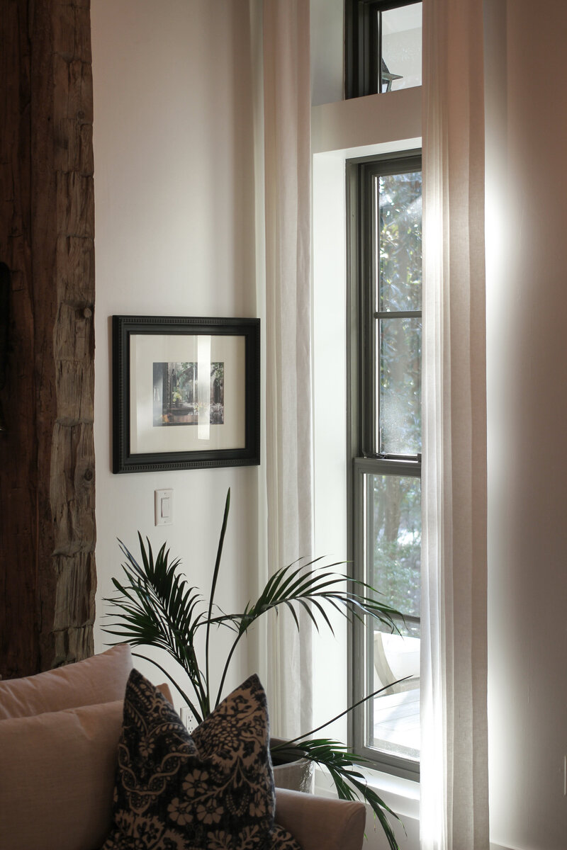 rustic-wood-column-sheer-curtains-tall-windows