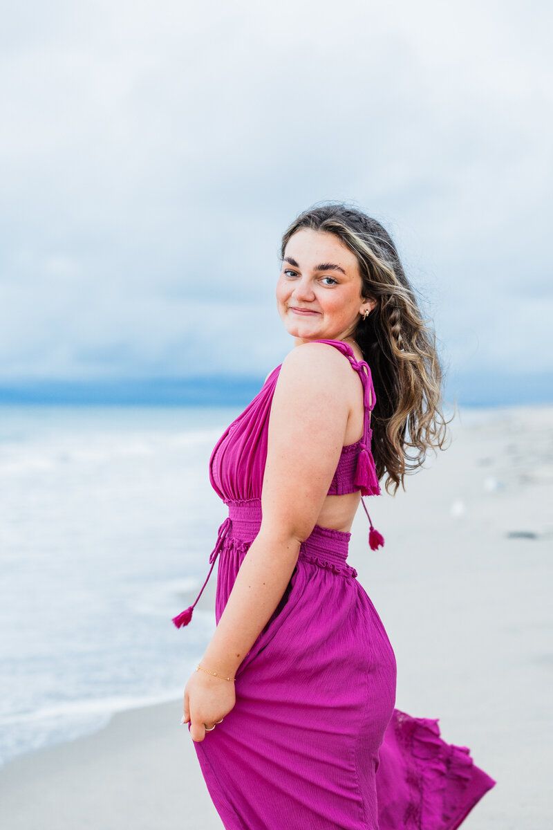 senior-in-pink-dress-by-Manhattan-pier