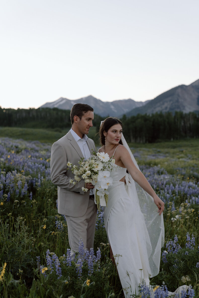 Elopement in crested butte colorado surrounded by wildflowers