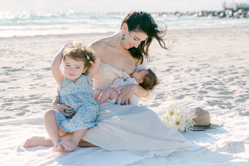 Breastfeeding mom on the beach