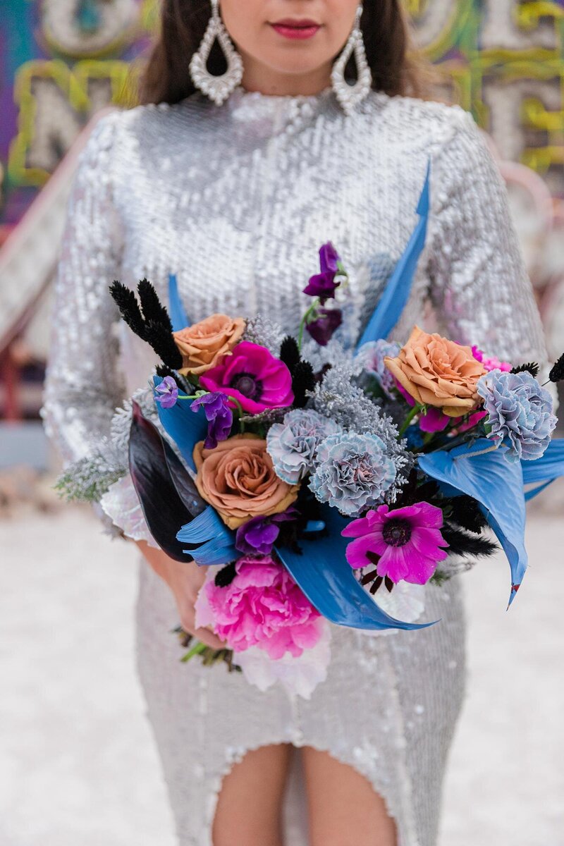 bridal bouquet and sequin wedding dress