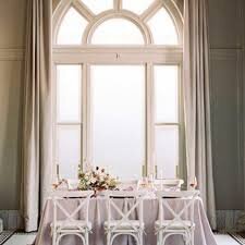 Room with huge window decorated in lilac and cream