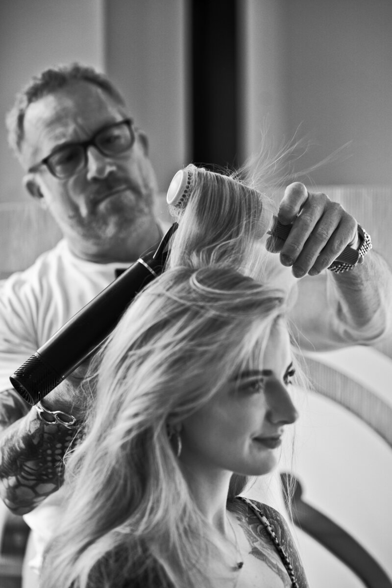 Woman getting a cut and blow out with Robert Govero