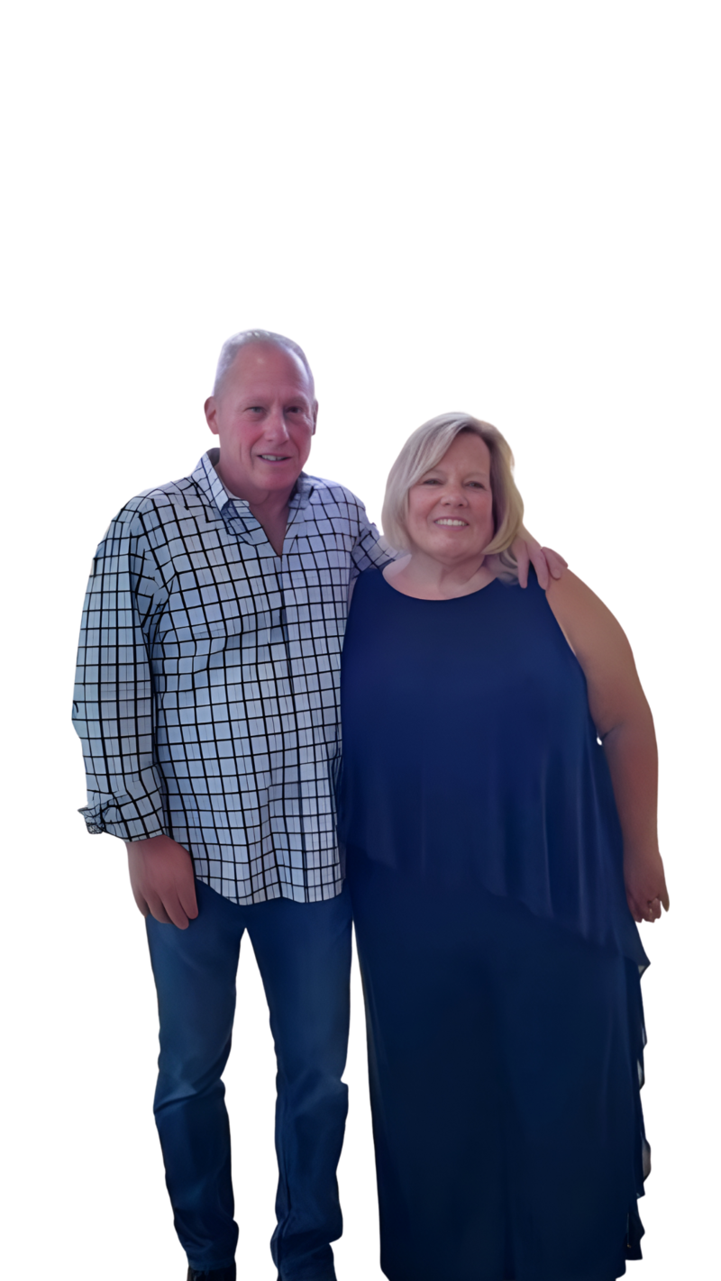 A photograph of a man and woman couple smiling at the camera