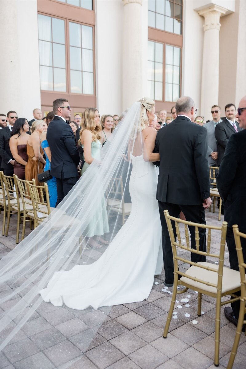 Bride walking down the aisle at the country club of Orlando.