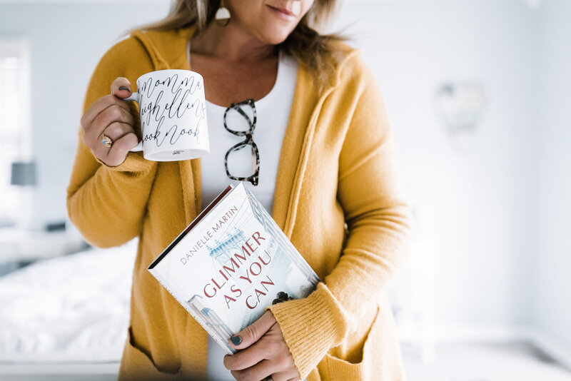 Momma Leighellen's Book Nook holds a book and a cup of coffee, sharing book reviews and offering author services such as content creation and author interviews