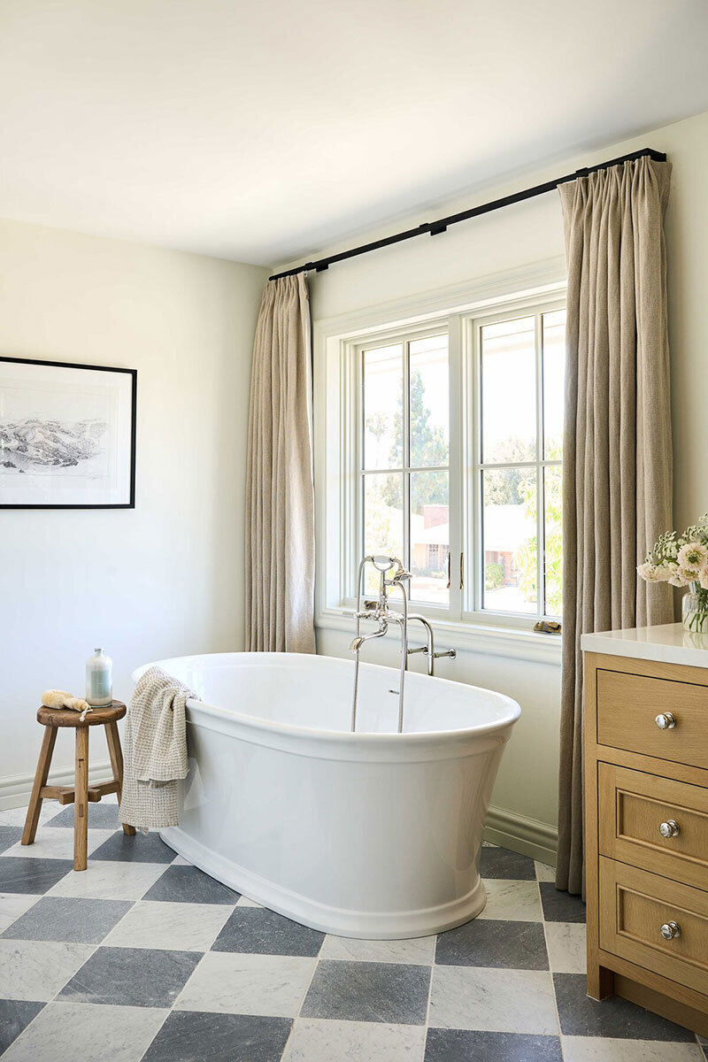 Bright bathroom with neutral palette and warm woods in a Orange County interior design project
