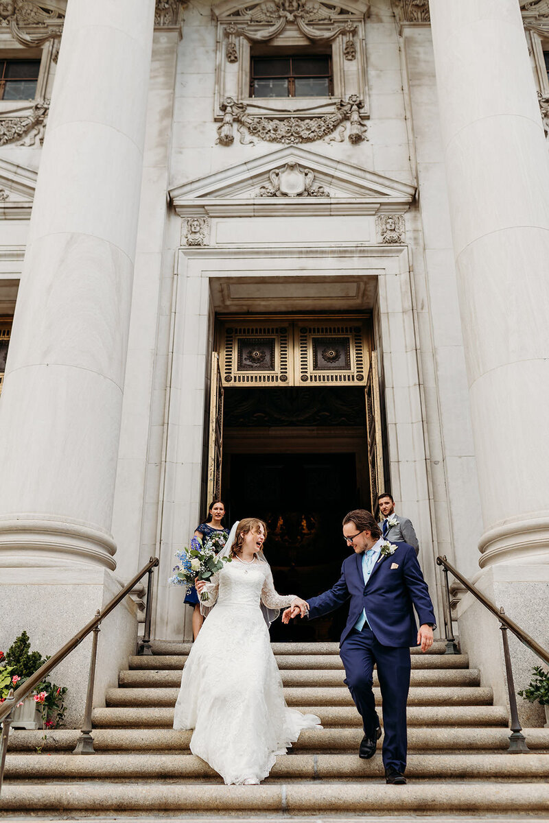 Bride and groom joyfully exit church after their wedding ceremony