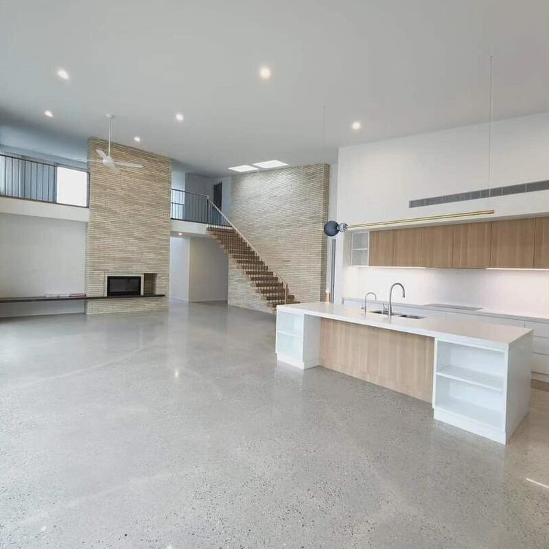 Sleek design for a modern kitchen with timber and concrete features for this custom built home