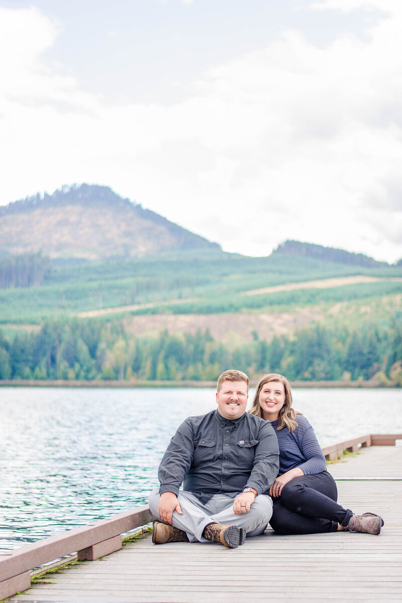 Couple on the docks of Dexter lake in Oregon