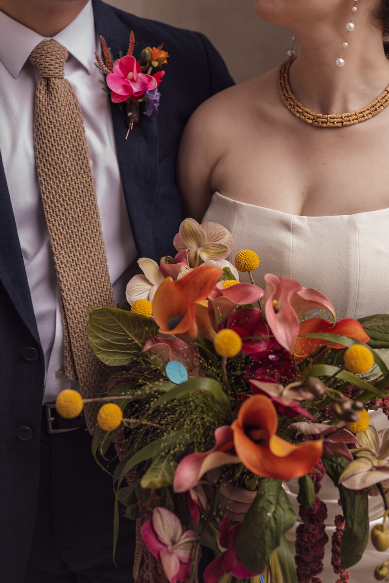 Wedding photographer captures couple taking a stroll hand in hand at their french chateau wedding.