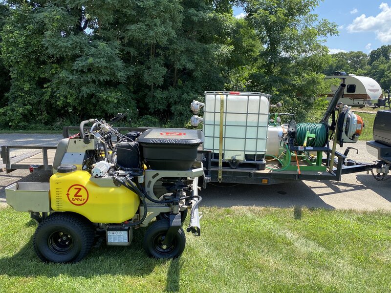 Lawn care equipment and tank on trailer ready for commercial landscaping services