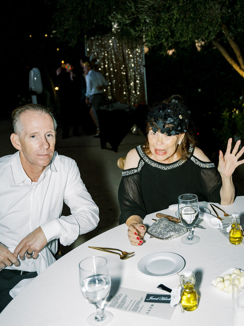 guests laughing during wedding reception in southern california
