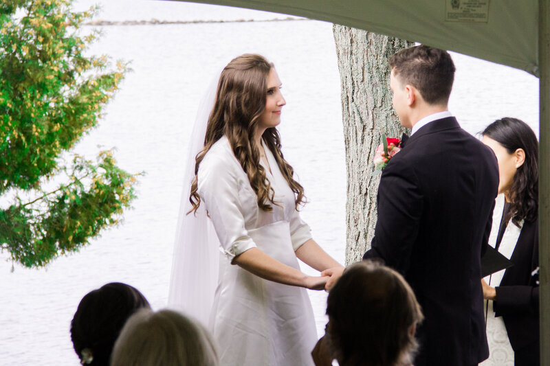 Couple holding hands during ceremony | Wedding Photography