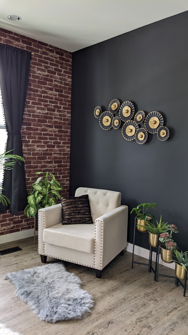 A styled chair sits in a well designed Vancouver Boudoir Studio
