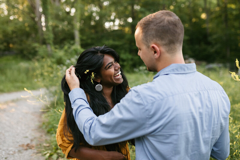 Man and woman smiling at each other during vibrant Nashville engagement session