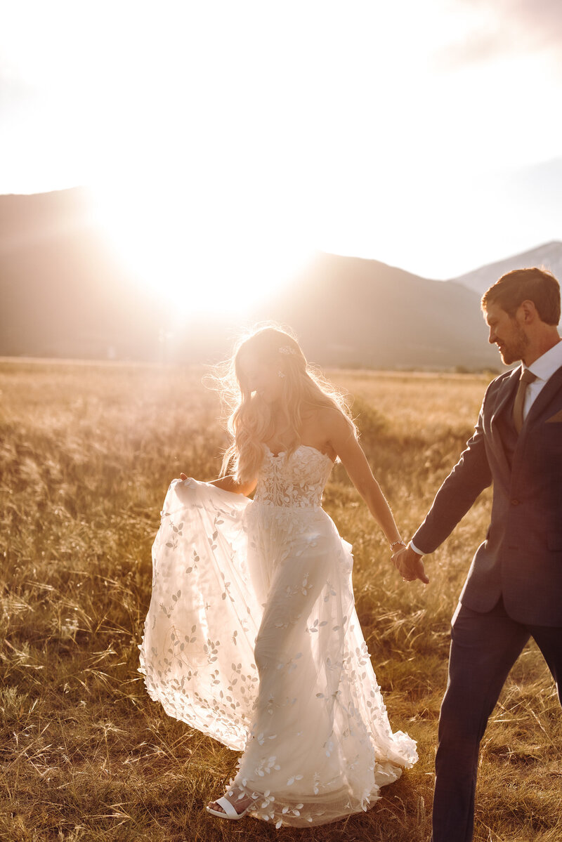 bride-and-groom-walking-into-sunset