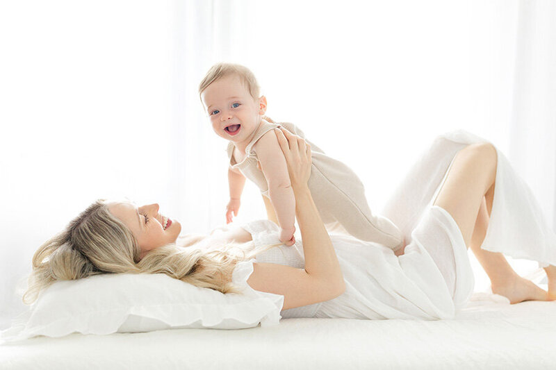 mom and baby boy during a milestone studio session in tampa with swapna fabbiano photography