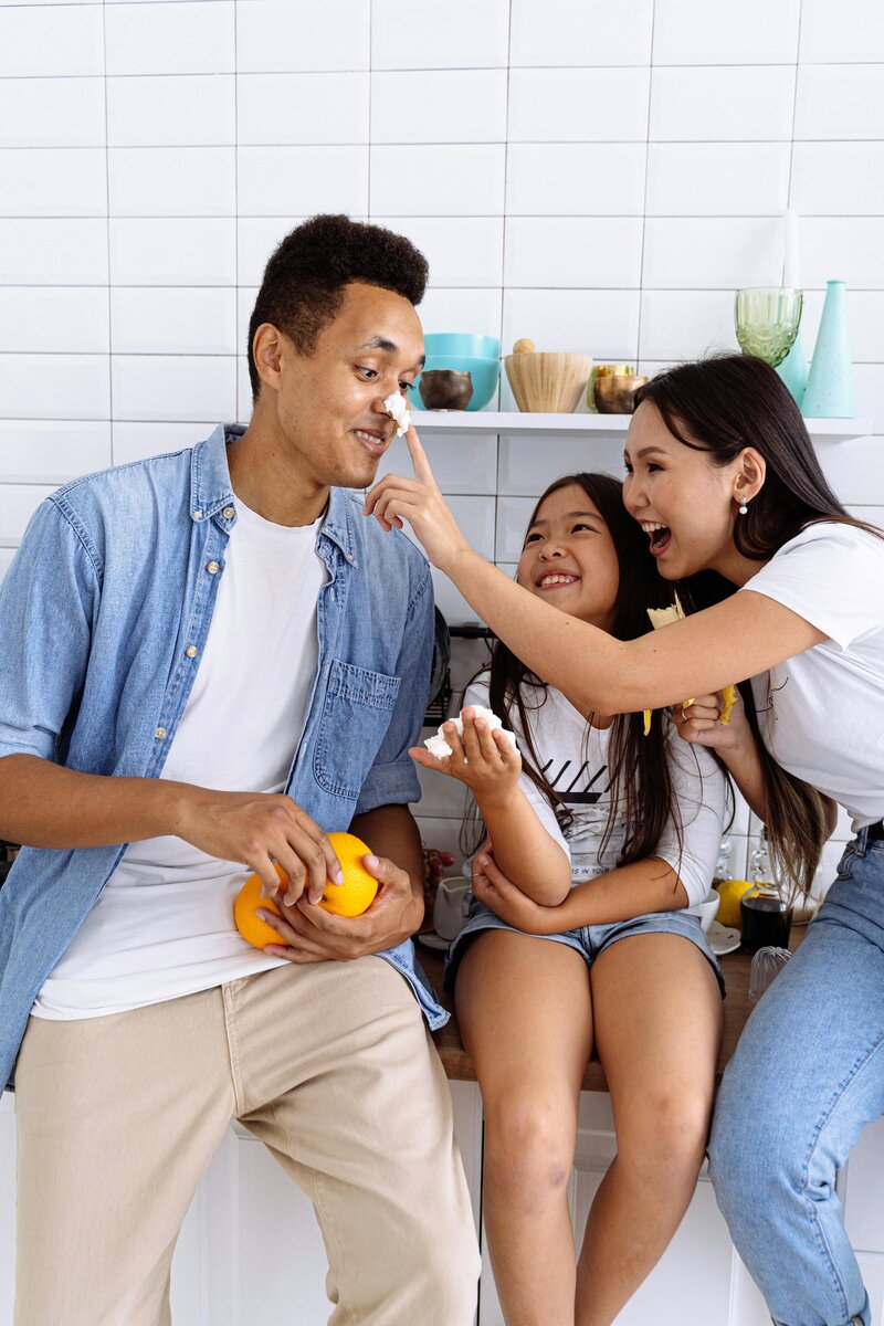 family playing in kitchen