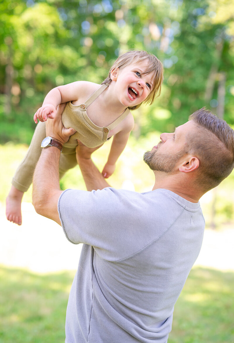 woman and man kneeling with doddle dog