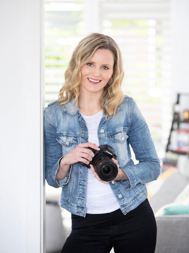 Photographer Alison McWhirter holding her camera