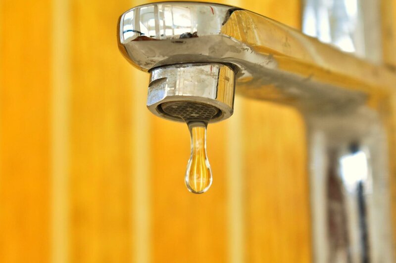 a sin faucet with water dripping