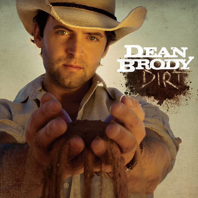 Dean Brody Dirt CCMA Award Winner Recording Package Album Cover closeup of Dean holding dirt with arms outstretched