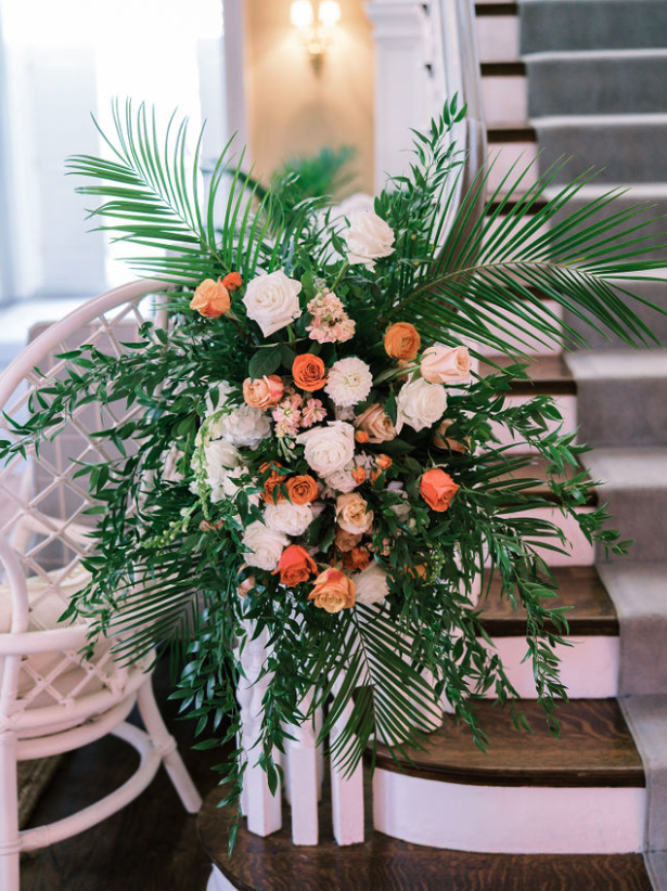 Reception table decorated with candles and beautiful flowers