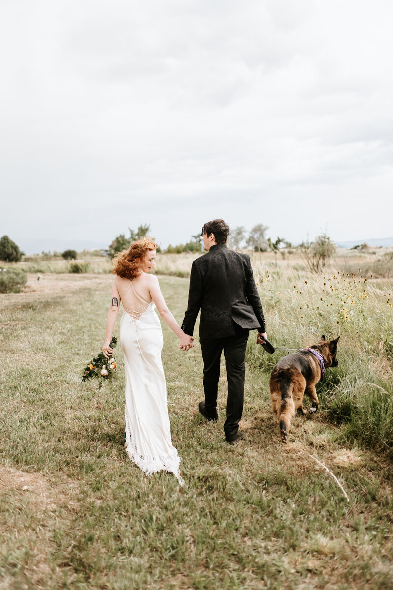 bride and groom running through bridal party tunnel