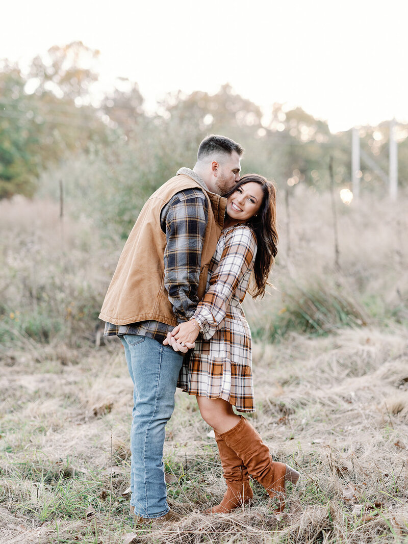 Couple fall engagement session wearing warm colors