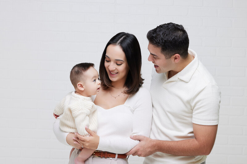 Clean and modern family portrait in studio