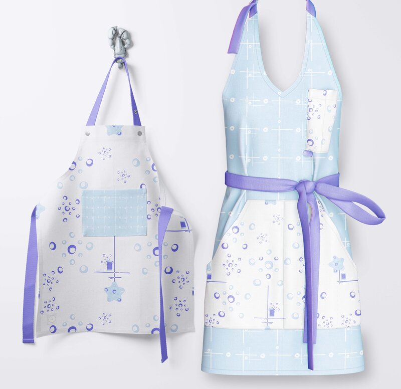 Patterned aprons hang on the wall