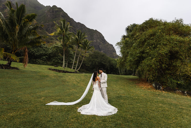couple embracing at Kualoa Ranch taken by Minnesota wedding photographer Marcus Hanenburg Photography