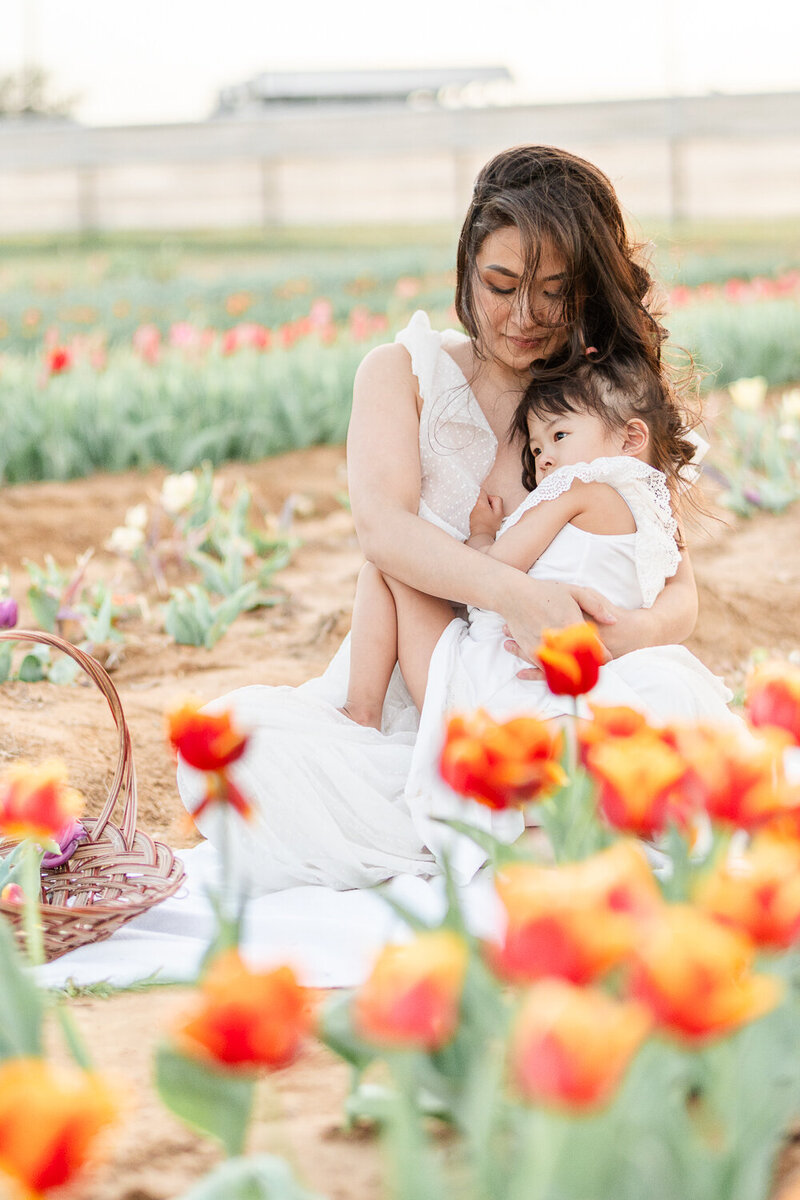 mother daughter in tulip field