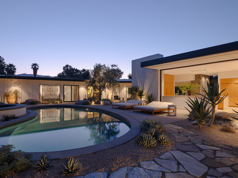 Modern residential kitchen design in Rancho Mirage with open slider designed by Los Angeles architect Sean Lockyer