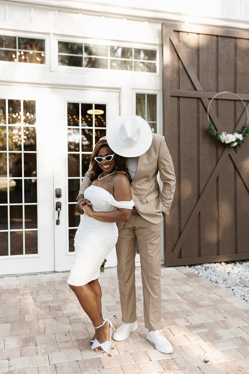 indie west photo portfolio image of groom embracing bride on wedding day