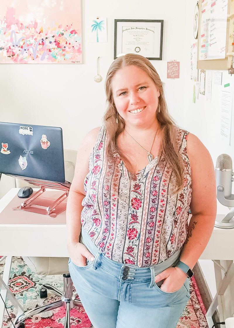 Photographer poses in home office