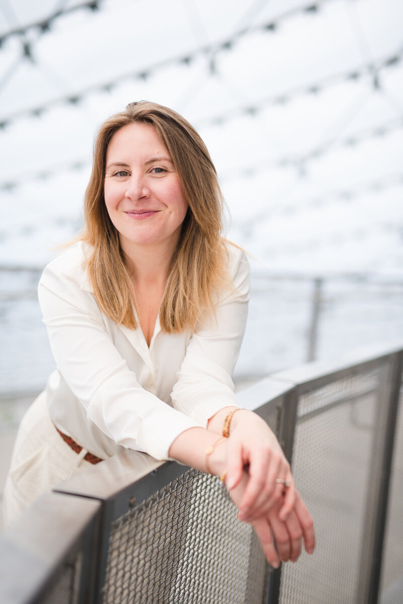 Jenna Harding smiling with contact banner for social media marketing and speaking inquiries